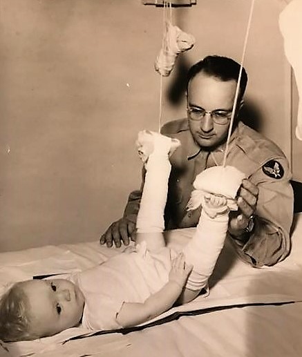 Doctor Harter with the child he treated